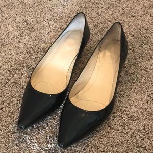 Black pointed toe pumps